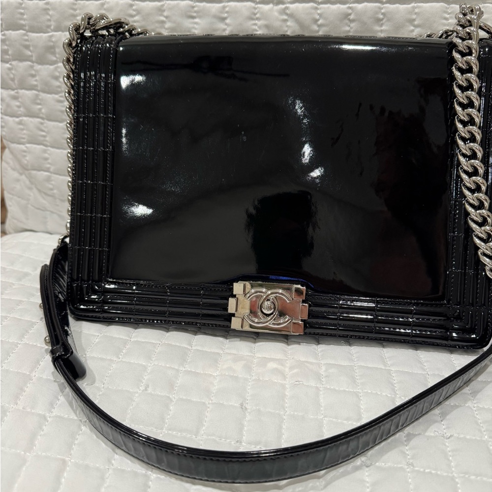 CHANEL black patent boy bag with silver hardware .